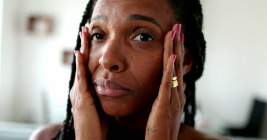 Anxious black African woman, stressed lady portrait face