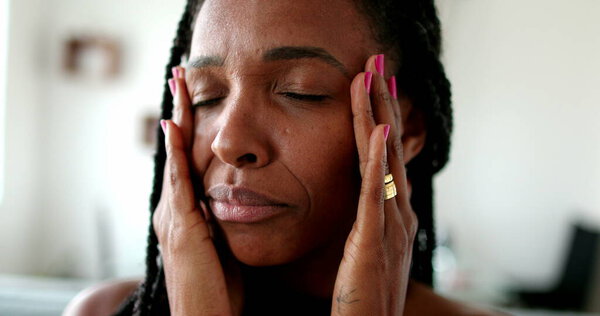 Anxious black African woman, stressed lady portrait face