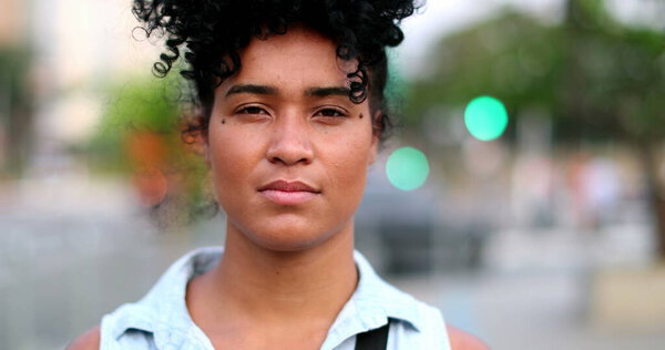 Black woman changing emotion becoming serious. Serious African person change mood