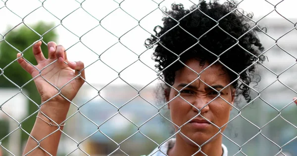Upset Young Black Woman Leaning Metal Fence — 스톡 사진