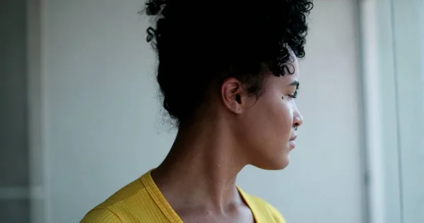 Thoughtful Young Black Woman Looking Out Home Window — 스톡 사진
