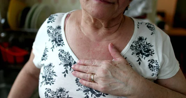 Portrait Hopeful Older Woman Putting Hand Chest — стоковое фото