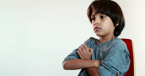 Pensive Child Boy Sitting Chair Thinking Kid Crossing Arms Feeling — Fotografia de Stock