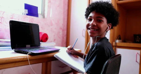 Child Doing Homework Home Writing Notes Kid Looking Camera Smiling — Stock fotografie