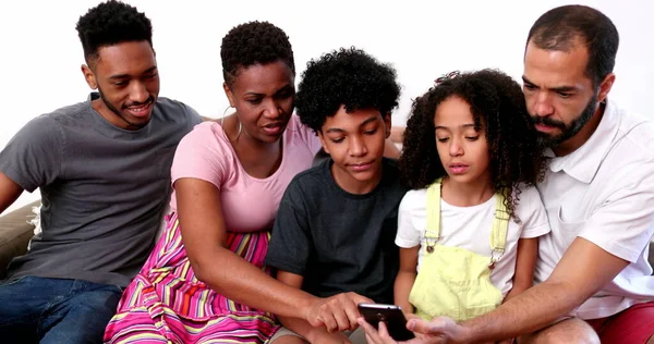 Diverse Interracial Family Home Couch Looking Cellphone — Stockfoto
