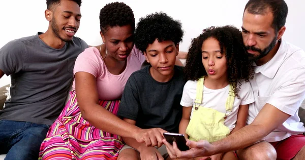 Diverse Interracial Family Home Couch Looking Cellphone — Stock Photo, Image