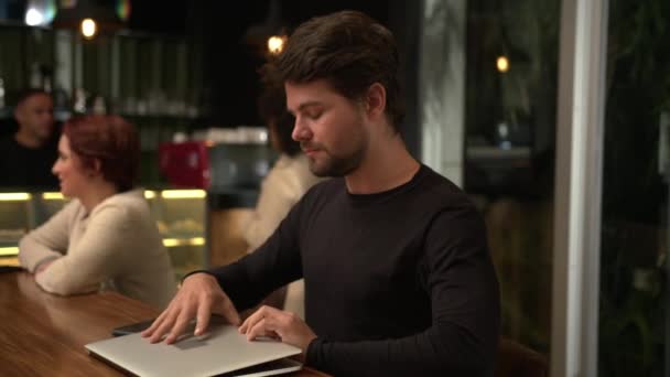 Man Opening Laptop Computer Coffee Shop Night Working Remotely — Stockvideo