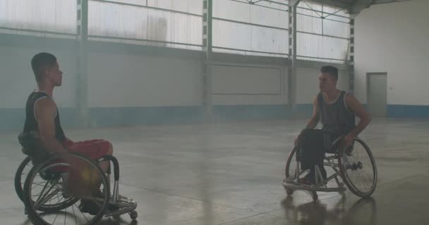 Two Disabled Paraplegic Basketball Players Training Indoors Ball — Video