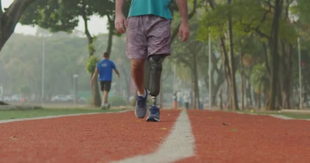 Disabled Athlete Walking Forward Prosthetic Leg Running Track — Video Stock