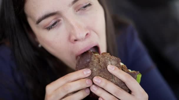 Woman Eating Cheeseburger Closeup Mouth Person Takes Bite Hamburger — Stock Video
