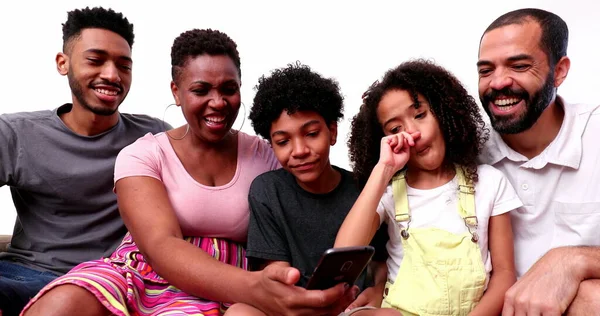 Happy Mixed Race Family Looking Phone Device Laughing Smiling — 스톡 사진