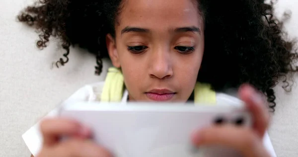 Little Girl Holding Smartphone Mixed Race Black Child Watching Content — Stockfoto