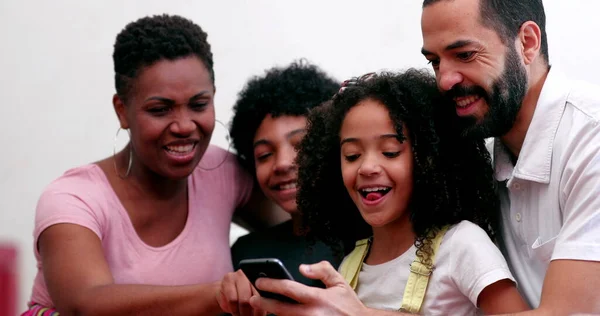 Interracial Family Kids Laughing Together Looking Cellphone Home Sofa — 스톡 사진
