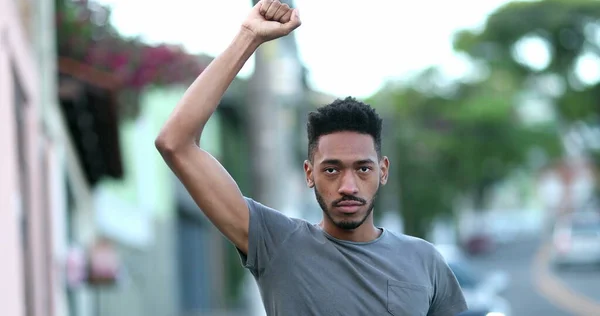 Individual Young Black Man Raising Fist Air Staring Camera Protest — 스톡 사진