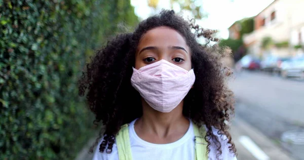 Mixed Race Girl Wearing Covid Face Mask Staring Camera — Fotografia de Stock