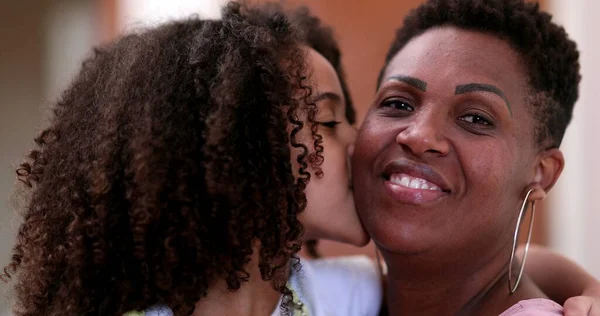 Mother and daughter family love and affection, mixed race african ethnicity