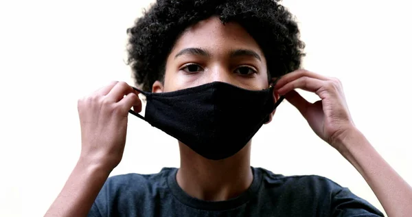 Mixed Race Kid Putting Covid Face Mask — Φωτογραφία Αρχείου