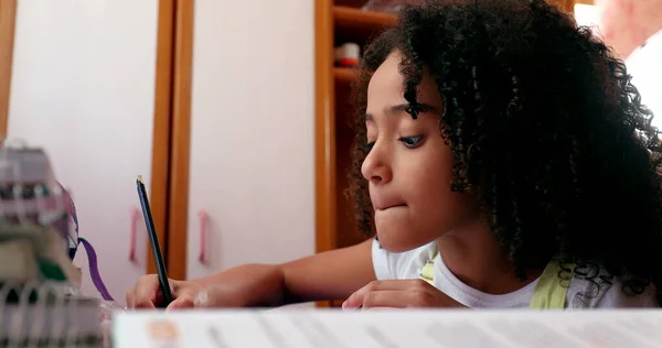Mixed Race Girl Writing Notes Doing Homework Home Little Girl — Φωτογραφία Αρχείου