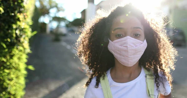 Mixed Race Girl Wearing Covid Face Mask Staring Camera — Stok fotoğraf