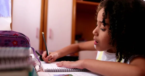 Smart Concentrated Little School Girl Doing Homework Writing Notes — Stock Fotó