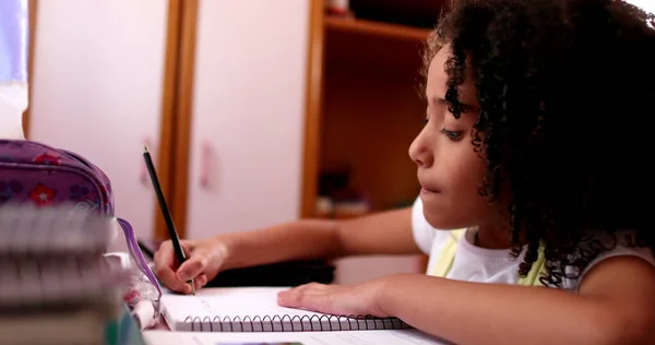 Smart Concentrated Little School Girl Doing Homework Writing Notes — Stok fotoğraf