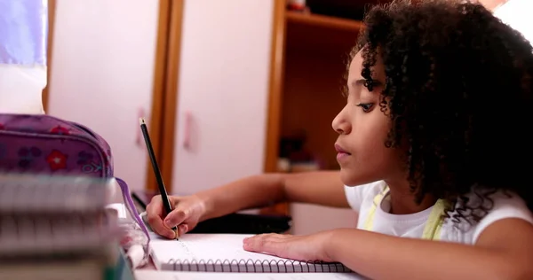 Smart Concentrated Little School Girl Doing Homework Writing Notes — 스톡 사진