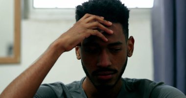 Pensive black man in trouble. African young person in difficult times