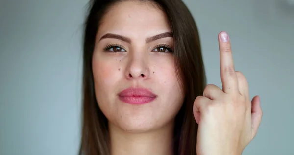 Millennial girl gives middle finger