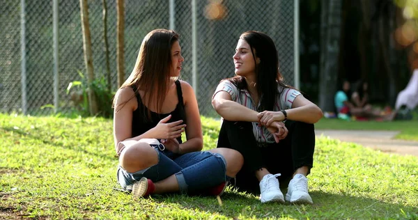 Two Female Friends Talking Park Candid Girlfriends Chatting — Foto de Stock