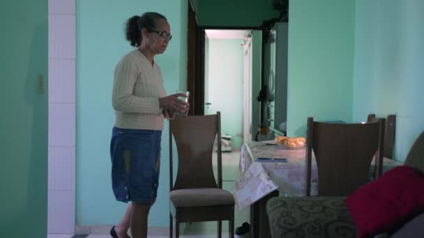 Senior Woman Sitting Table South American Hispanic Mature Older Woman — Vídeo de Stock