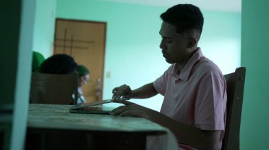 A hispanic man opening laptop screen and searching online at home