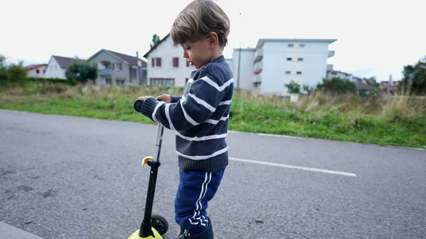 Child Rides Toy Scooter — Stockfoto