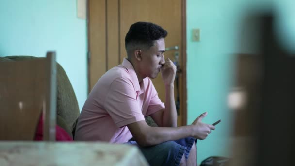 Thoughtful Hispanic Man Looking His Phone Home One Latin Person — Stock videók