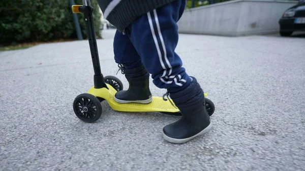 Child Rides Toy Scooter — Zdjęcie stockowe