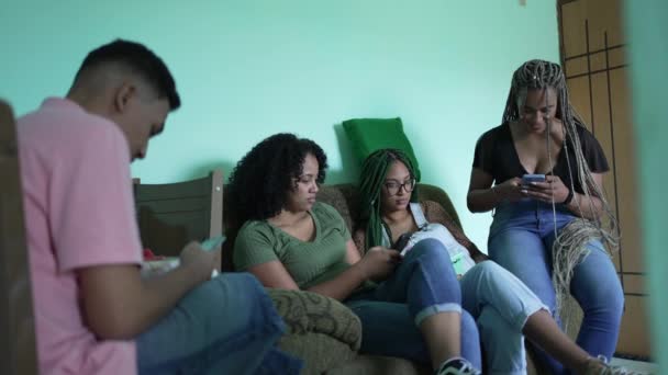 Candid Group Using Phones Sitting Couch Four Hispanic Black Friends — Video Stock