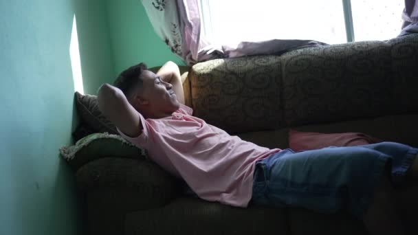 One Comfortable Hispanic Man Lying Couch Relaxing Home — 图库视频影像