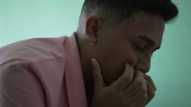 Depressed man in crisis. Sad unhappy person covering face suffering from mental illness