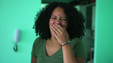 One happy black woman spontaneous laugh and smile