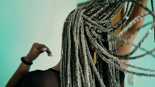 An African American woman with braided hairstyle