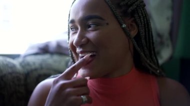 Candid female friends laughing. Two young black women real life laugh and smile