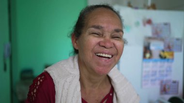 One happy senior hispanic woman A latina South American older lady laughing and smiling portrait face