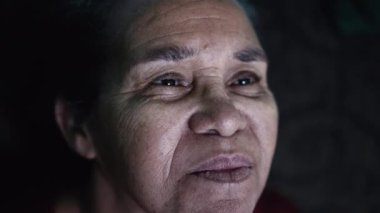 One older hispanic black woman portrait face closeup. A senior South American elder