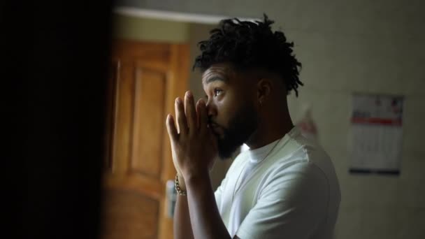 Religious Young Man Standing Home Praying God — Vídeos de Stock