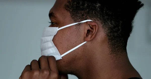 Profile African Man Putting Surgical Face Mask — Fotografia de Stock