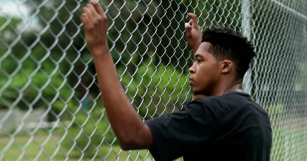 Pensive Young Black Man Leaning Metal Fence Contemplative Mixed Race — Fotografia de Stock