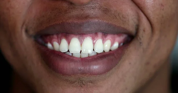 Close-up black man mouth smiling