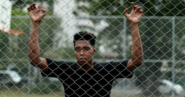Angry Young Black Man Looking Camera Leaning Metal Fence Upset — Stock Fotó