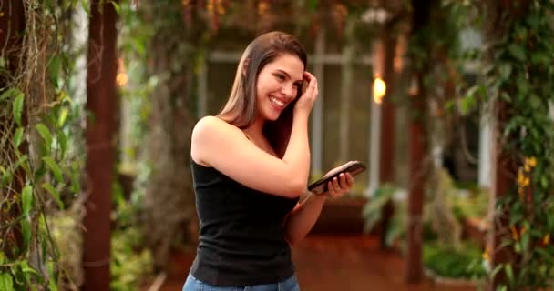 Beautiful Smiling Young Woman Using Cellphone — Video