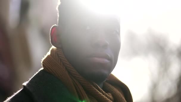 Young Black Man Standing Sunflare Sunlight Pensive Thoughtful — Stockvideo