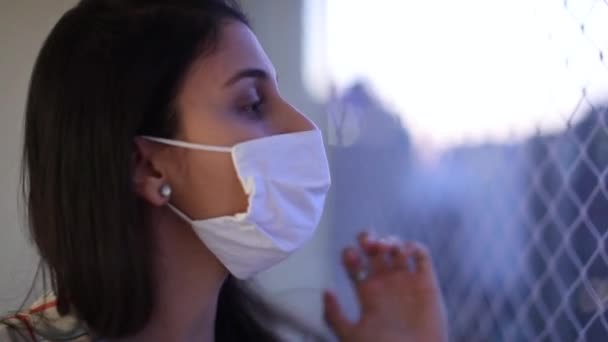 Casual Young Woman Putting Covid Face Mask Indoors — Stockvideo